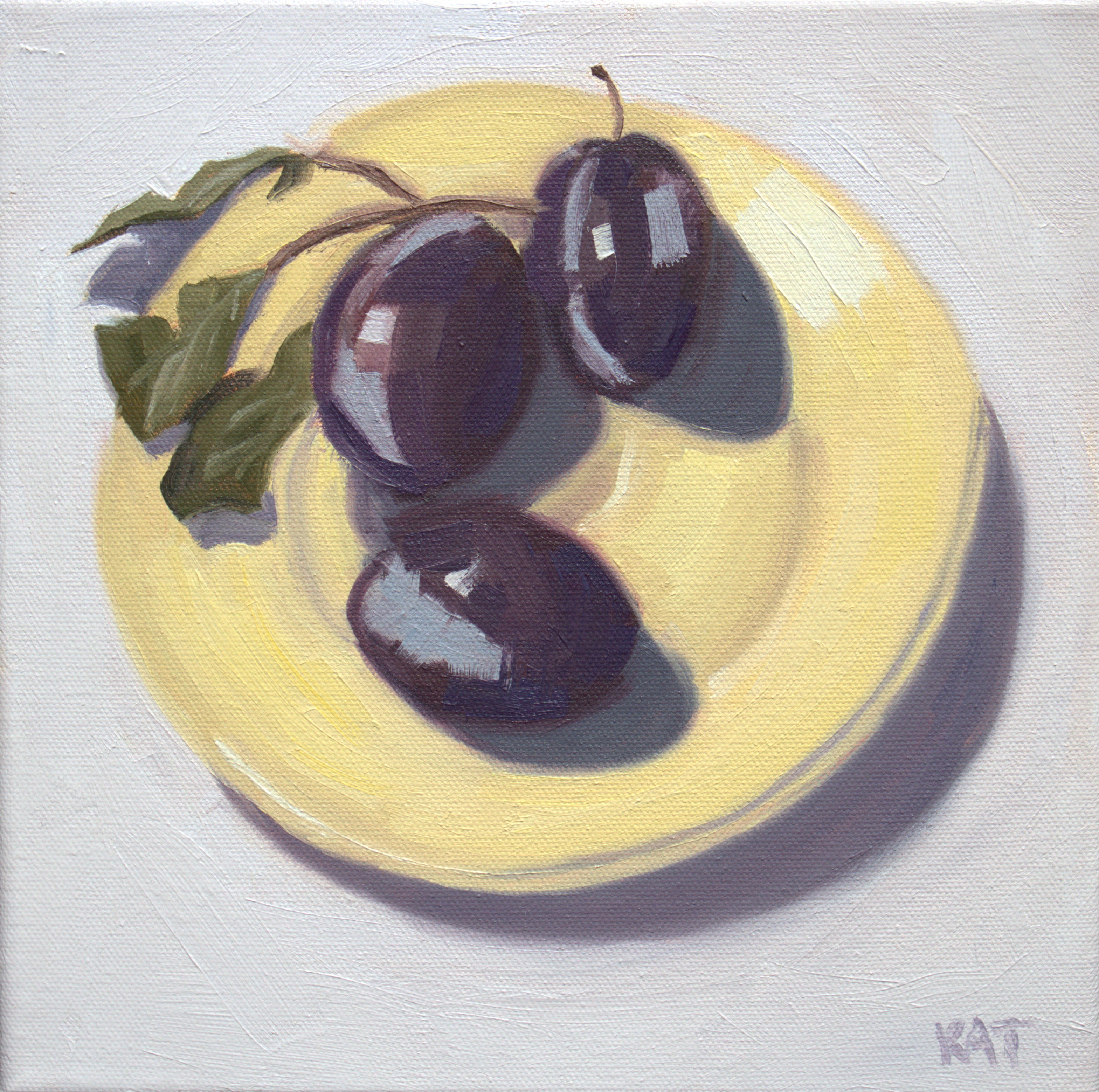 Plums on Yellow Plate
